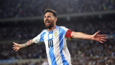 Lionel Messi celebrates joyfully after scoring the decisive goal for Argentina against Colombia in the World Cup.