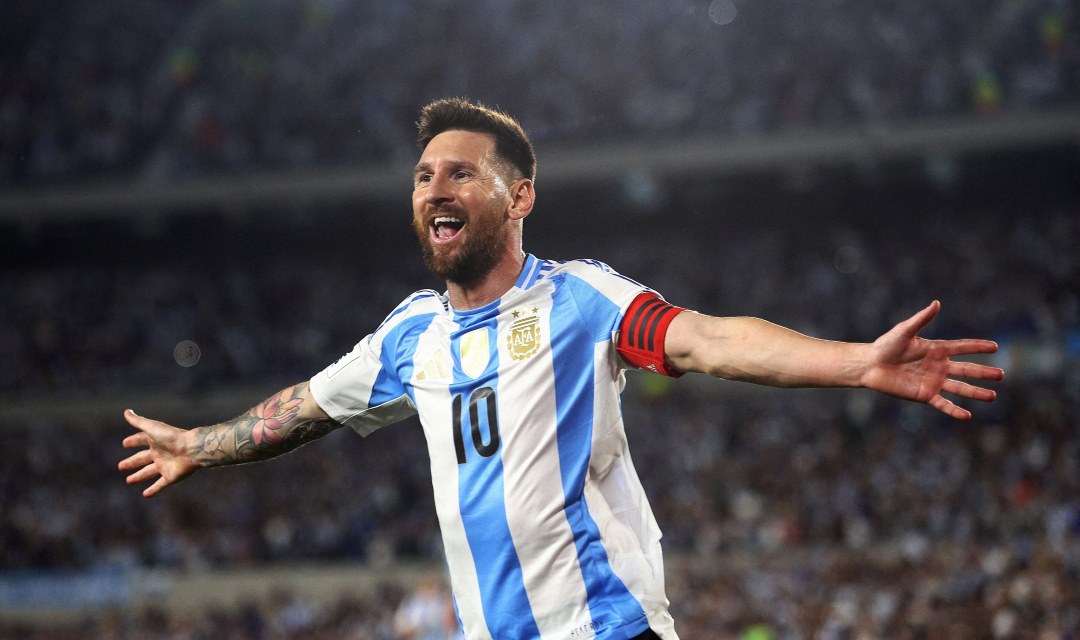 Lionel Messi celebrates joyfully after scoring the decisive goal for Argentina against Colombia in the World Cup.