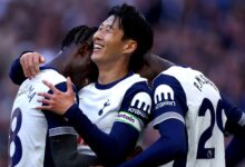 Son Heung-min celebrates with teammates after scoring Tottenham Hotspur's second goal during a match