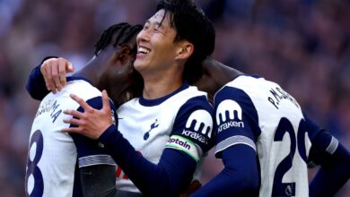 Son Heung-min celebrates with teammates after scoring Tottenham Hotspur's second goal during a match