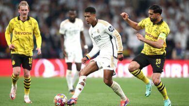 Real Madrid and Borussia Dortmund players compete in a UEFA Champions League match