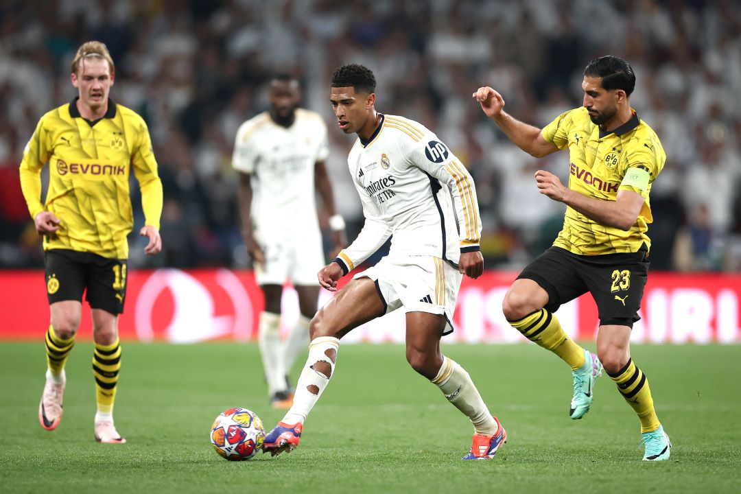 Real Madrid and Borussia Dortmund players compete in a UEFA Champions League match