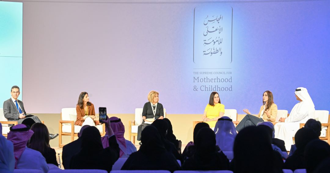 "Panel discussion at Supreme Council for Motherhood & Childhood event with an audience."