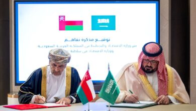 "Oman and Saudi officials sign a memorandum of understanding during a formal meeting."