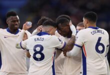 Chelsea players celebrate a goal against Leicester City