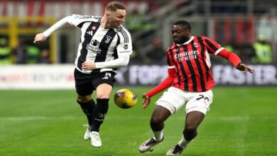 Milan and Juventus players compete for the ball