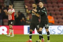 Robertson celebrates with Salah during Liverpool's match against Southampton