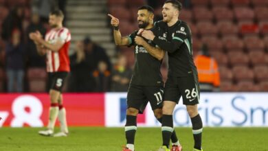 Robertson celebrates with Salah during Liverpool's match against Southampton