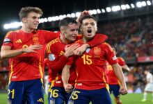 Spain players celebrate with Bryan Zaragoza after his goal against Switzerland.