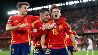 Spain players celebrate with Bryan Zaragoza after his goal against Switzerland.