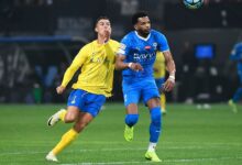 Ronaldo and Ali Al-Bulayhi compete for the ball