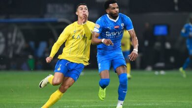 Ronaldo and Ali Al-Bulayhi compete for the ball