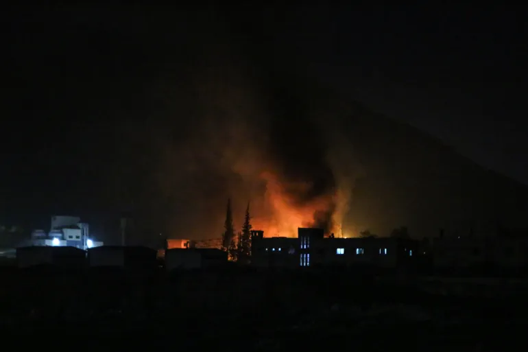 Smoke rises from the outskirts of the Syrian capital